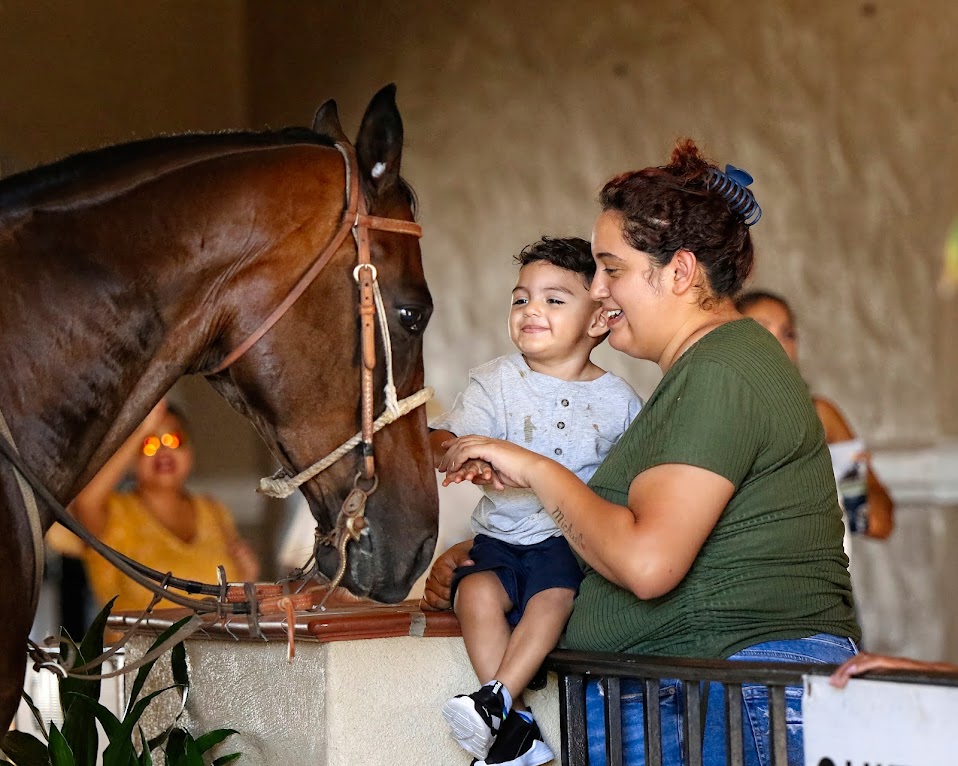 "Horses and Children = Joy" (Del Mar Thoroughbred Club, Del Mar, CA - September 5, 2022), photograph by Gary Schwartzwald