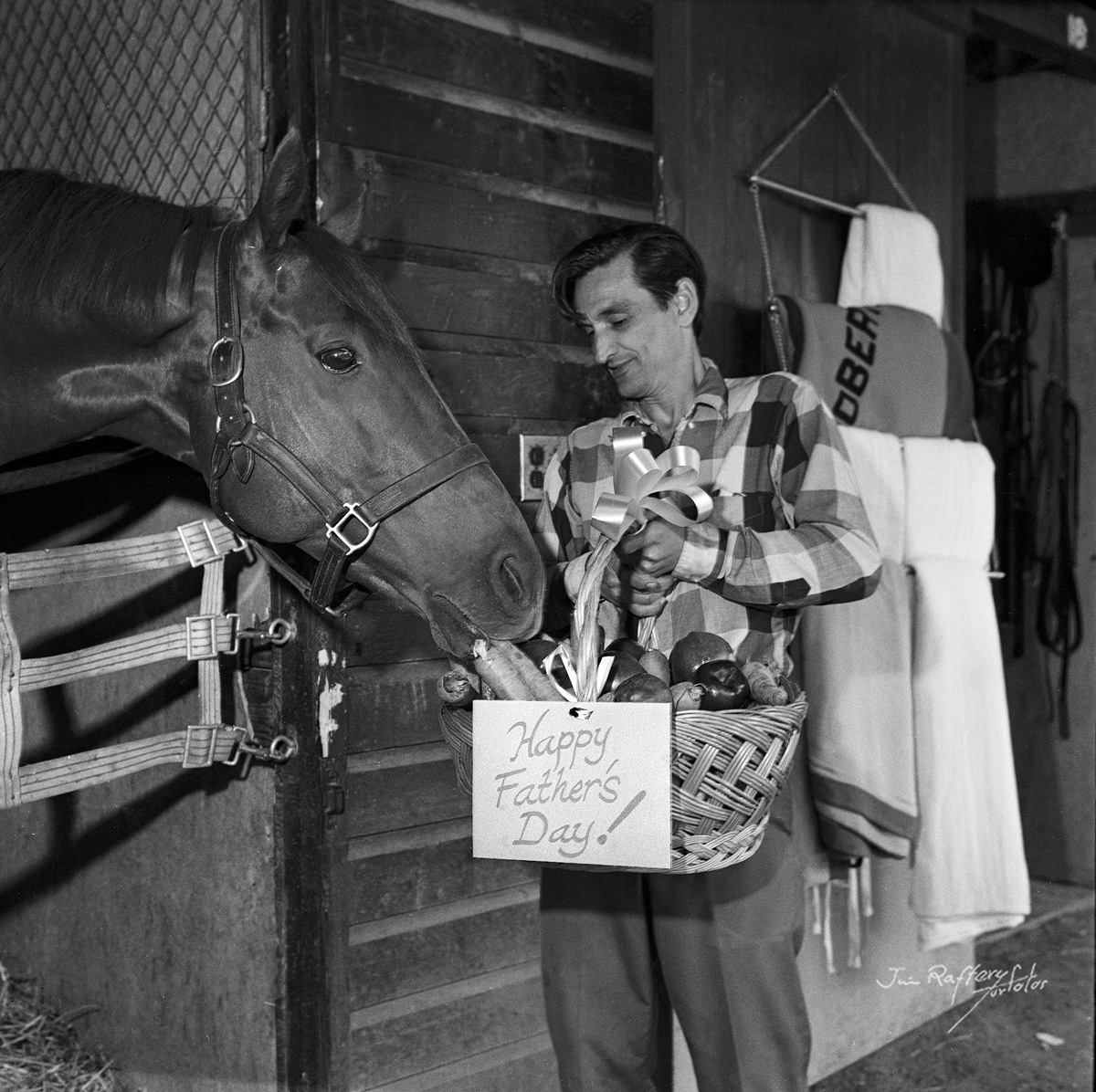 Big Rock Candy with trainer Leonard Loveridge, for a Father's Day promotion photograph. The caption noted that Big Rock Candy was "Father of the Year." (Jim Raftery Turfotos)