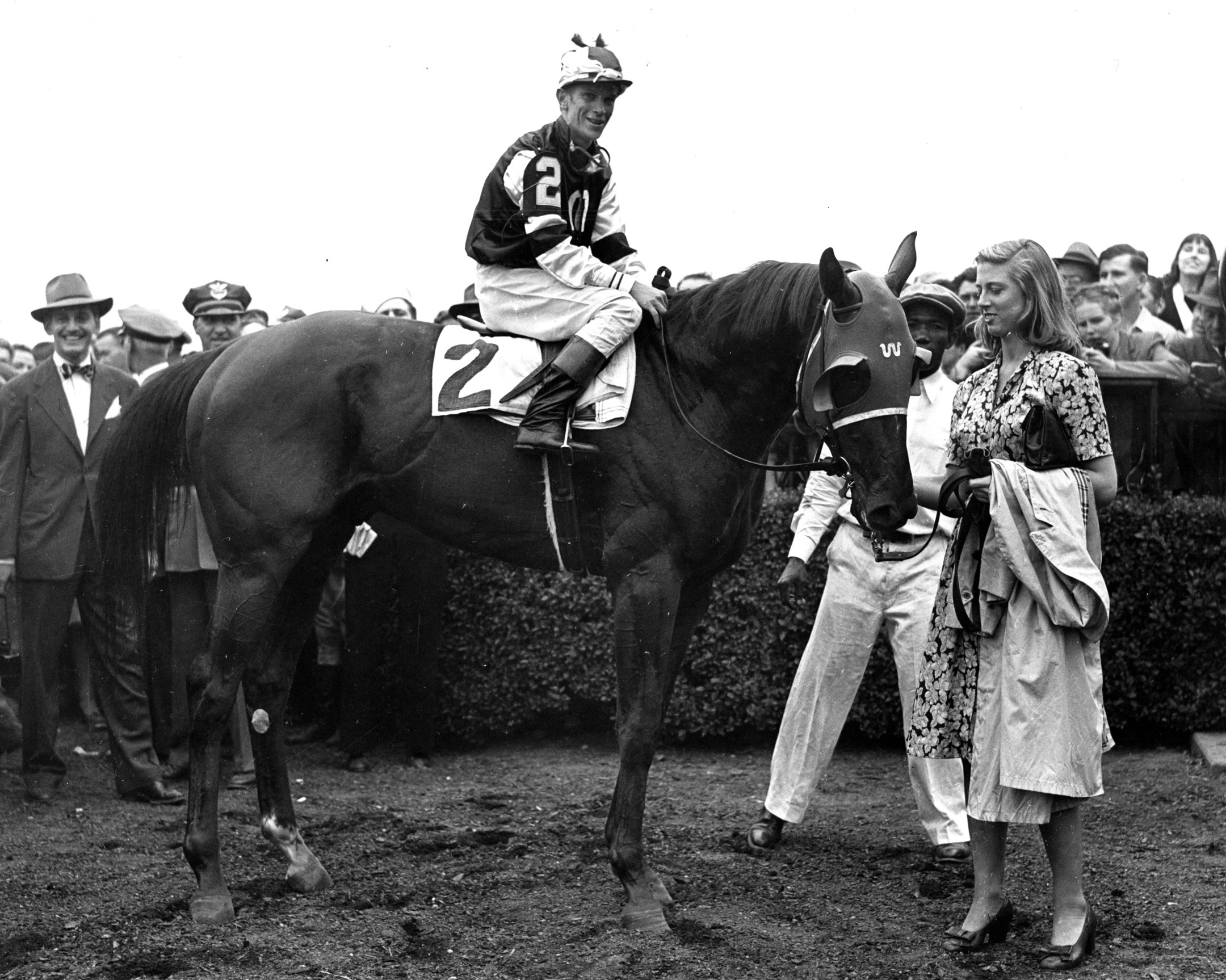 Assault in the 1946 Belmont Stakes winner's circle after winning the Triple Crown (Museum Collection)