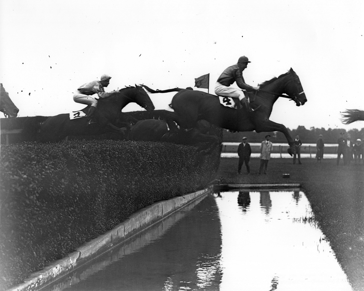 Battleship (Carroll K. Bassett up) clearing a water jump in the American Grand National Steeplechase at Belmont Park (Keeneland Library Morgan Collection/Museum Collection)