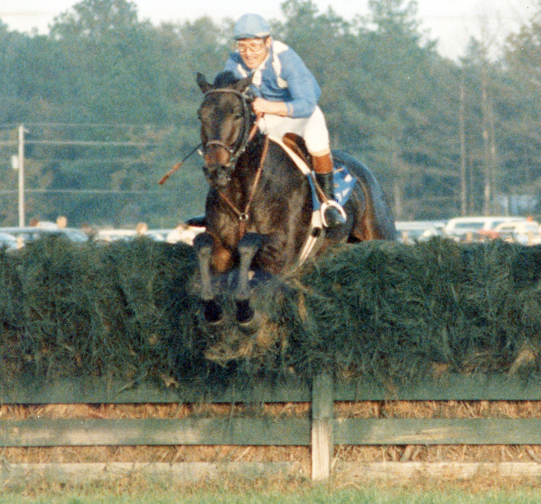 Flatterer (Jerry Fishback up) taking a jump in the Colonial Cup (Catherine French/Museum Collection)