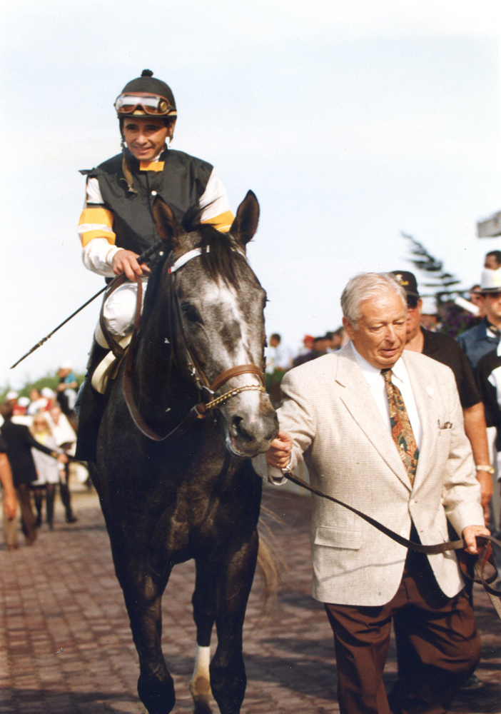 Holy Bull (Mike Smith up) being led in by owner/trainer Warren A. "Jimmy" Croll, Jr. after winning the 1994 Metropolitan (Barbara Ann Giove Coletta/Museum Collection)