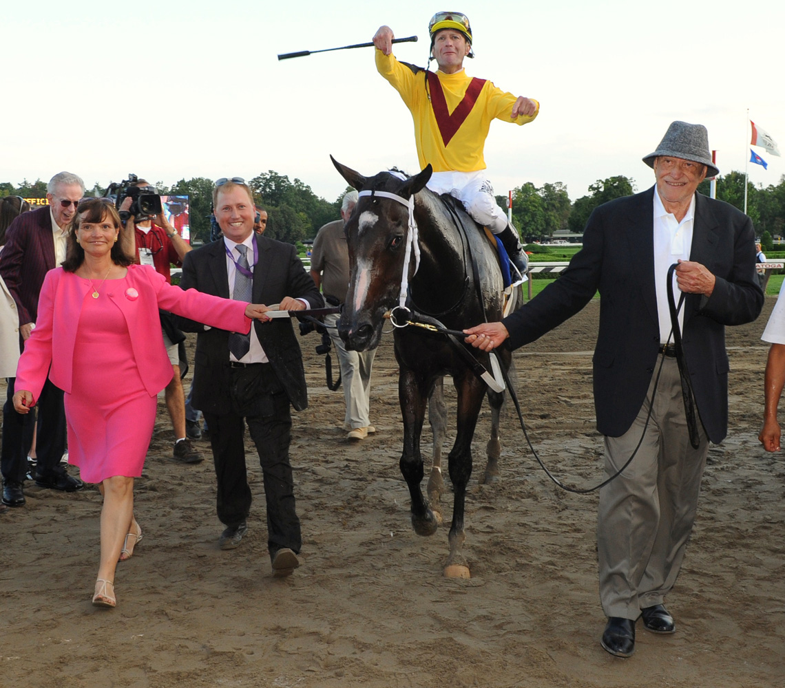 Rachel Alexandra (Calvin Borel up) being led into the winner's circle by owners Barbara Banke and Jess Jackson after winning the Woodward (NYRA)