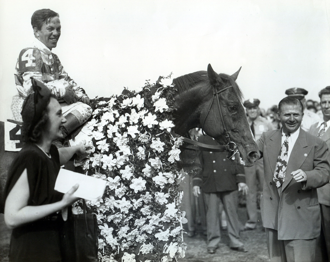 Stymie (Conn McCreary up) with owner Ethel D. Jacobs and trainer Hirsch Jacobs after winning the 1947 Empire City Gold Cup at Belmont (Museum Collection)