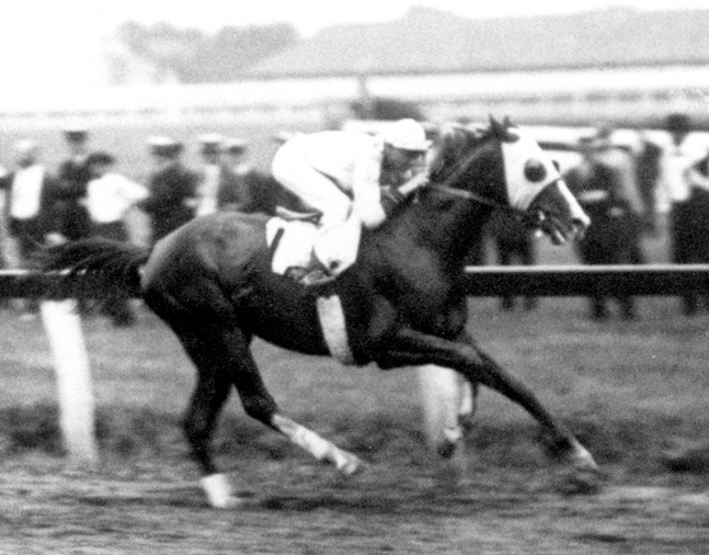 Grey Lag racing to victory with Earl Sande up (Keeneland Library Cook Collection/Museum Collection)