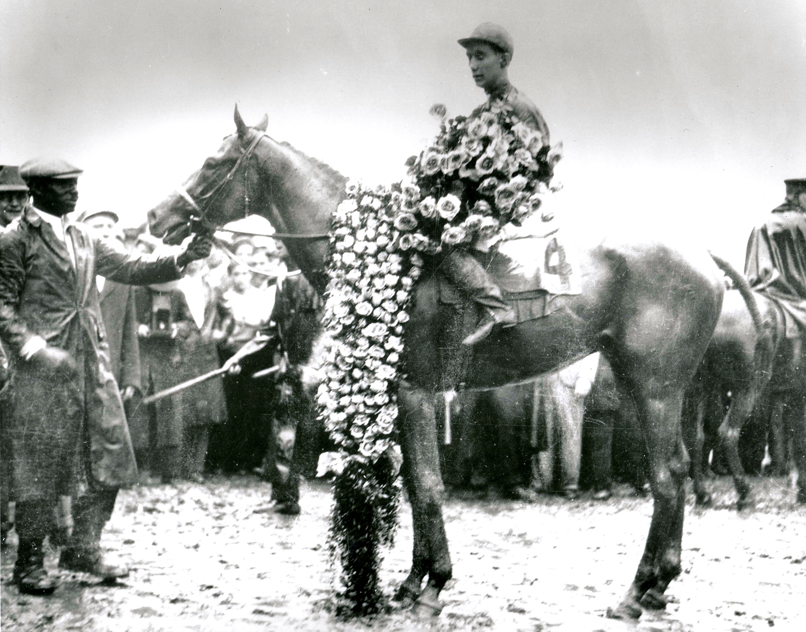 Reigh Count (Chick Lang up) in the winner's circle for the 1928 Kentucky Derby (Churchill Downs Inc./Kinetic Corp. /Museum Collection)