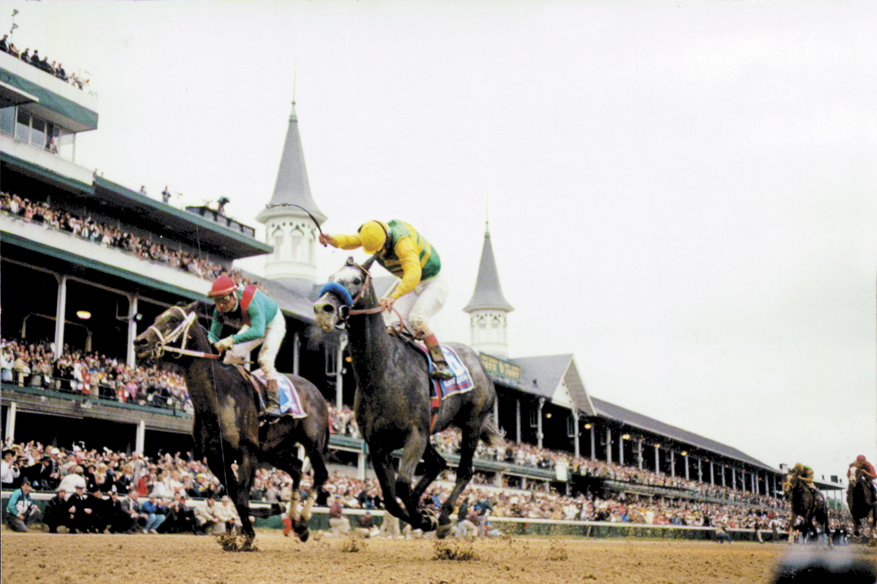 Silver Charm (Gary Stevens up) charging down the stretch to win the 1997 Kentucky Derby by a head (Skip Dickstein)