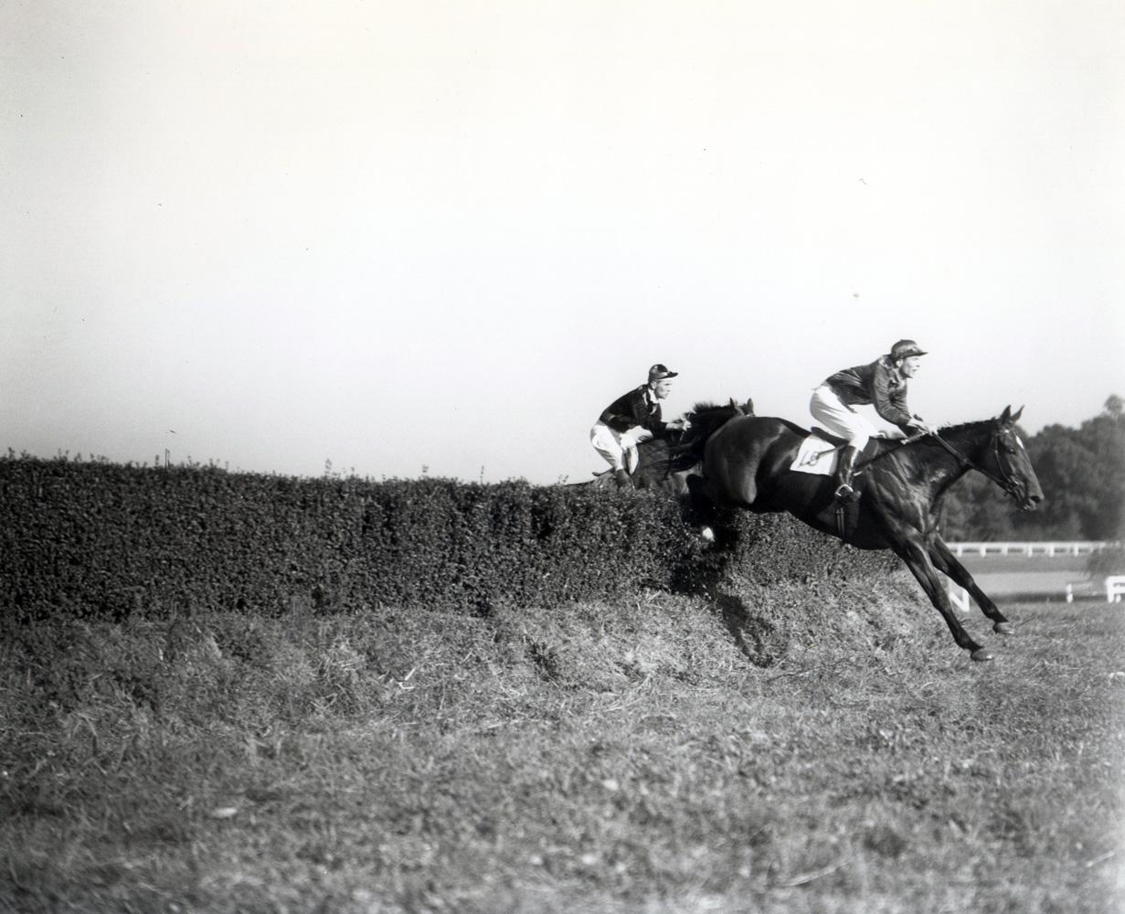 Carroll Bassett and Passive competing in the King Oak Steeplechase at the Huntington Valley Hunt Races (Keeneland Library Morgan Collection/Museum Collection)