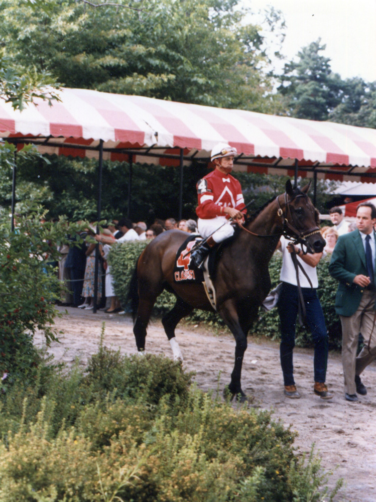 Earlie Fires and Classy Cathy about to enter the track with the post parade for the 1986 Alabama at Saratoga (Mike Pender/Museum Collection)