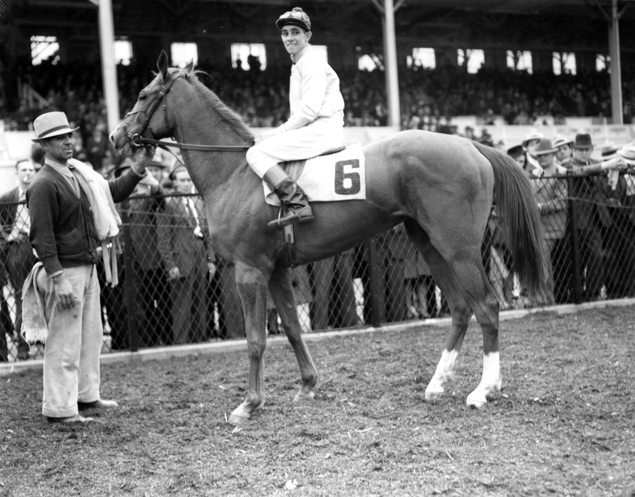 Ralph Neves and an unidentified horse in the winner's circle at Pimlico, April 1940 (Keeneland Library Morgan Collection/Museum Collection)
