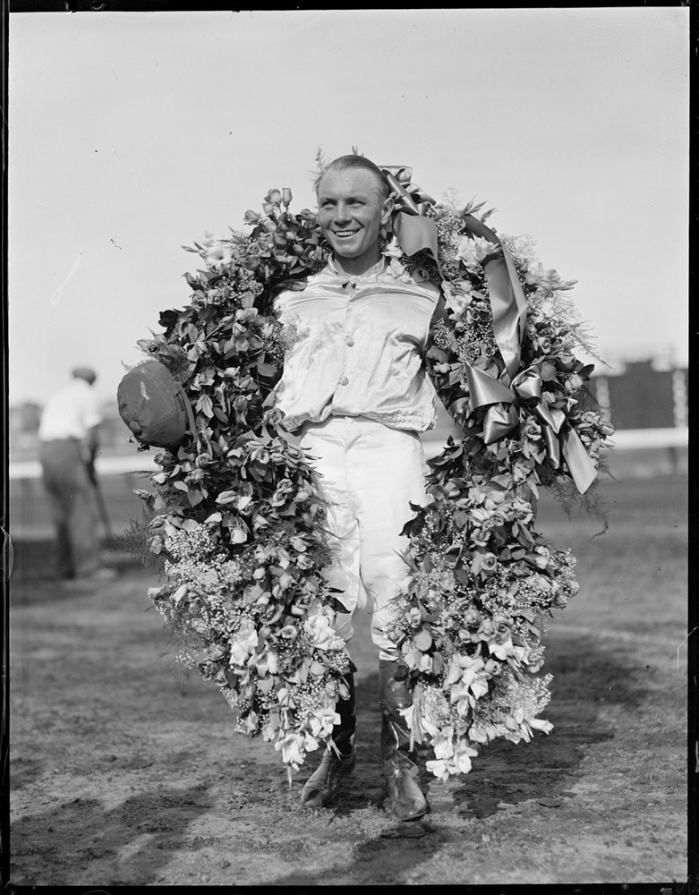 Raymond Workman with Time Supply's wreath after winning the 1936 Massachusetts Handicap at Suffolk Downs (Courtesy of the Boston Public Library, Leslie Jones Collection)