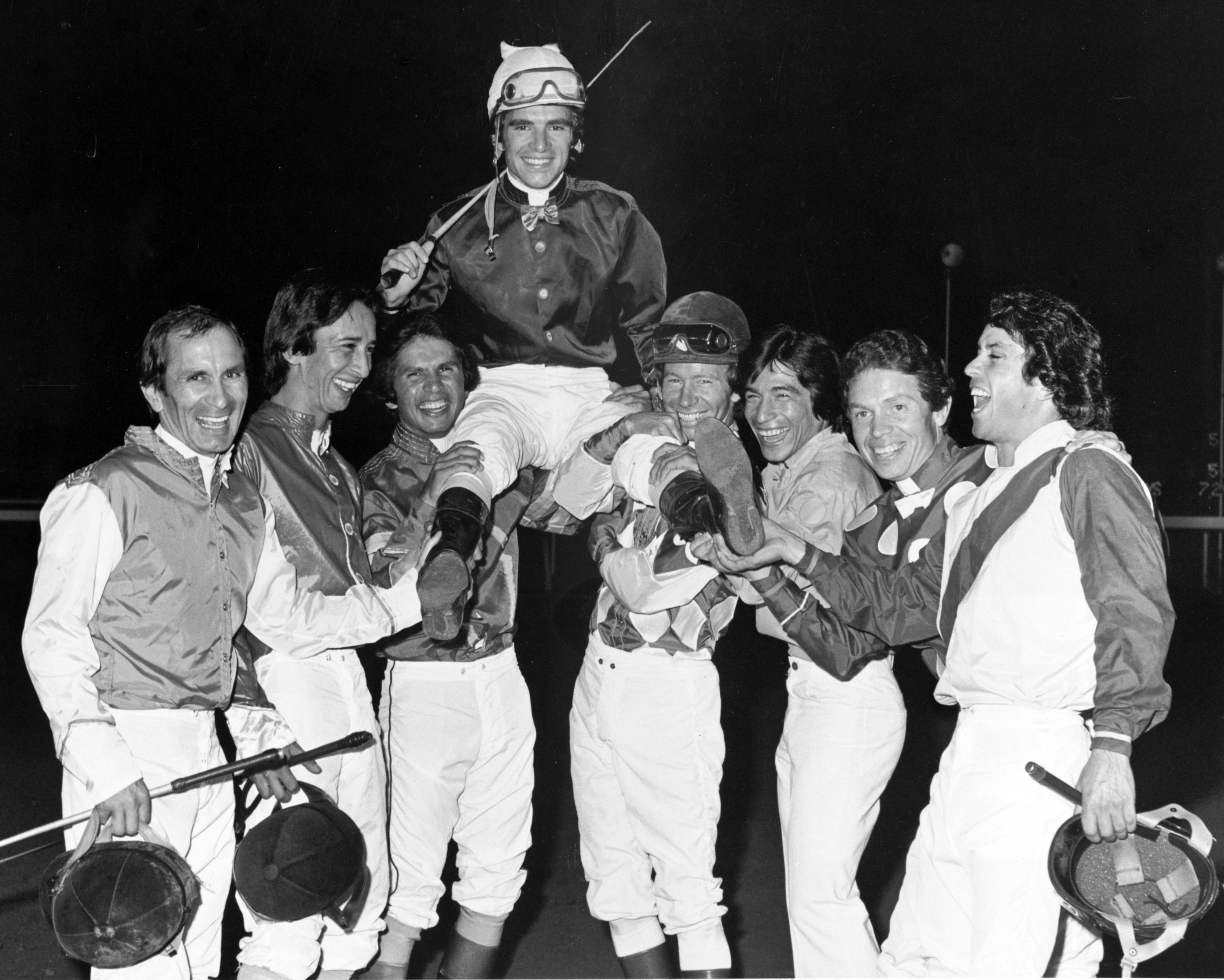 Darrel McHargue being lifted up in celebration by the Hollywood Park jockey colony after his second consecutive Moonlight Derby win (Keeneland Library Thoroughbred Times Collection)