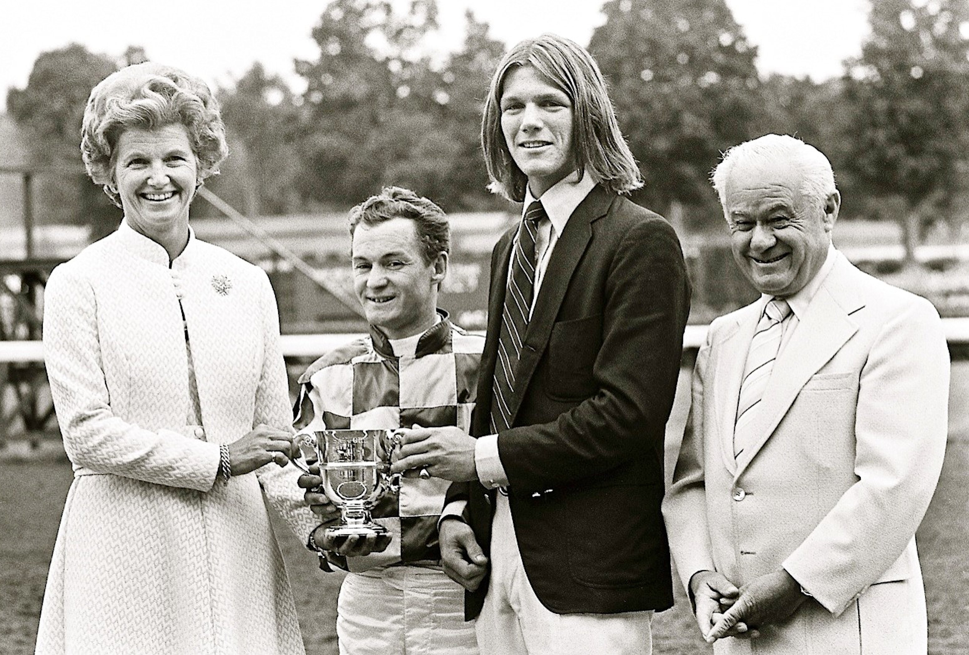 Penny Chenery, left, celebrates with Ron Turcotte, an unidentified individual, and Lucien Laurin, after Secretariat's victory in the 1972 Sanford Stakes at Saratoga (Douglas Lees)