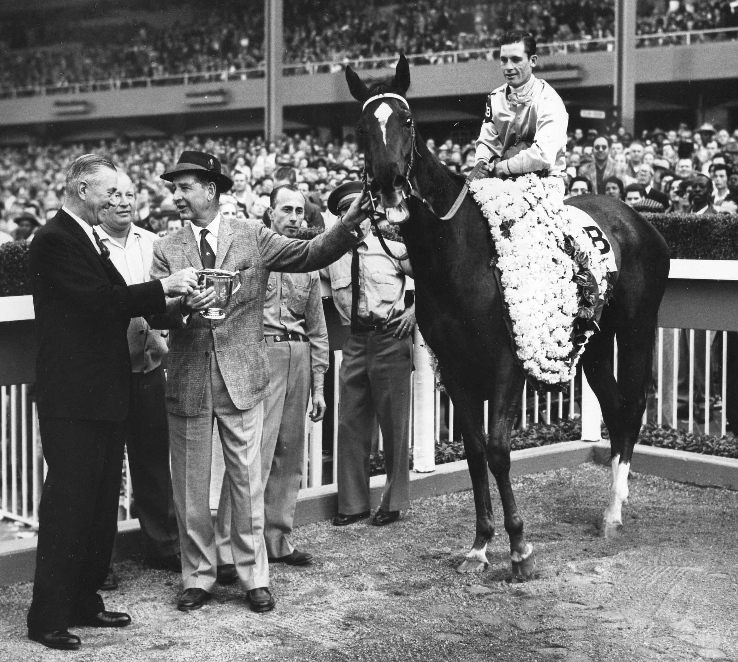 C. V. Whitney in the winner's circle with Silver Spoon (Raymond York up) for the 1959 Santa Anita Derby (Wide World Photos/Museum Collection)