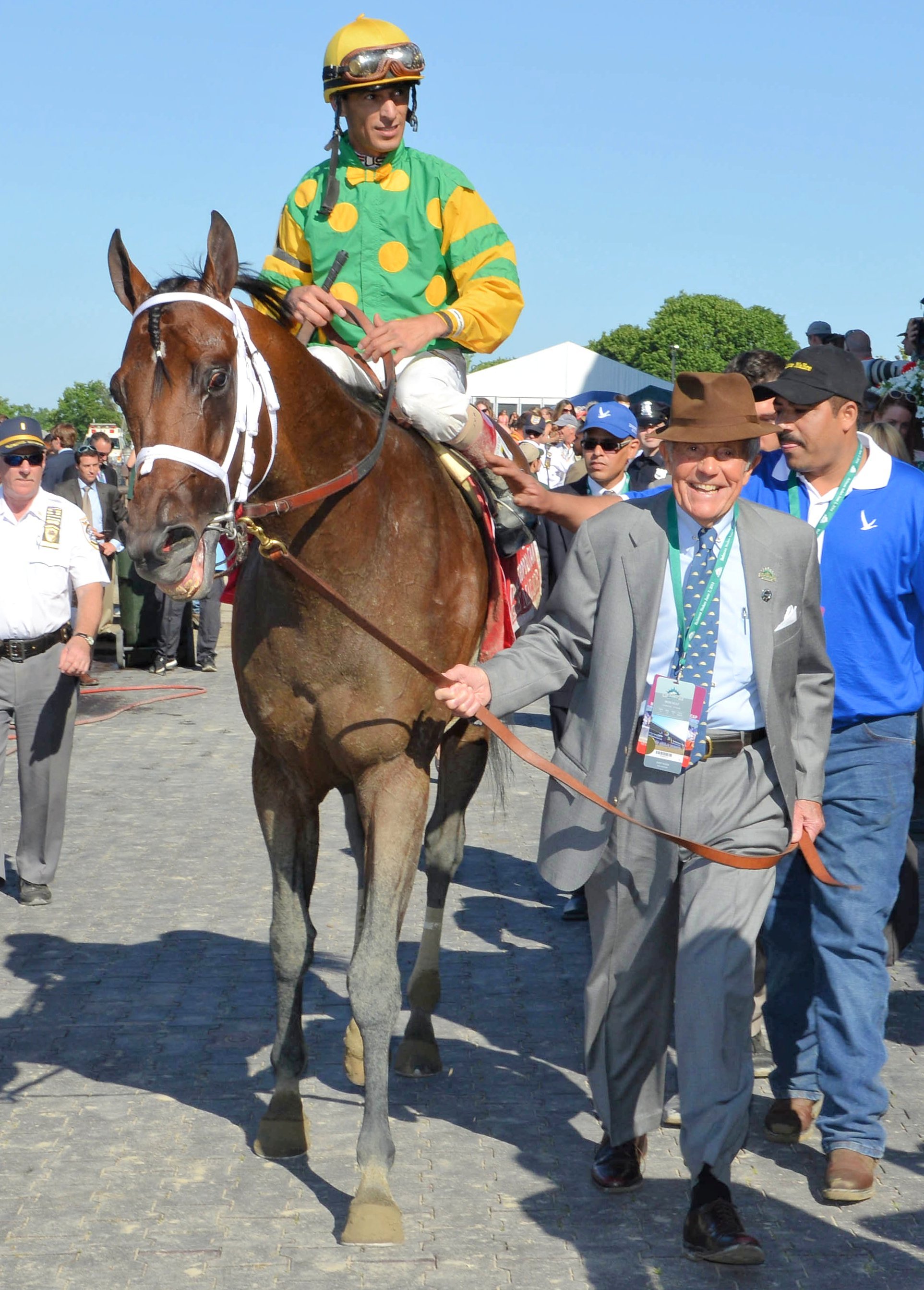 Cot Campbell leading in Palace Malice (John Velazquez up) after winning a race (NYRA)