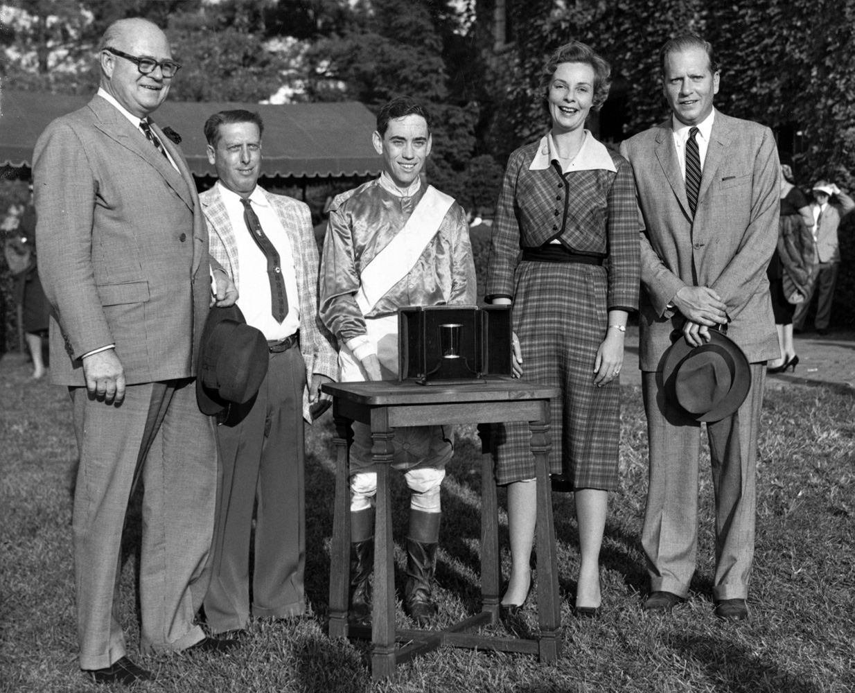 E. P. Taylor presents a trophy to Reynolds and Alice Headley Bell at Keeneland (Keeneland Library Thoroughbred Times Collection)