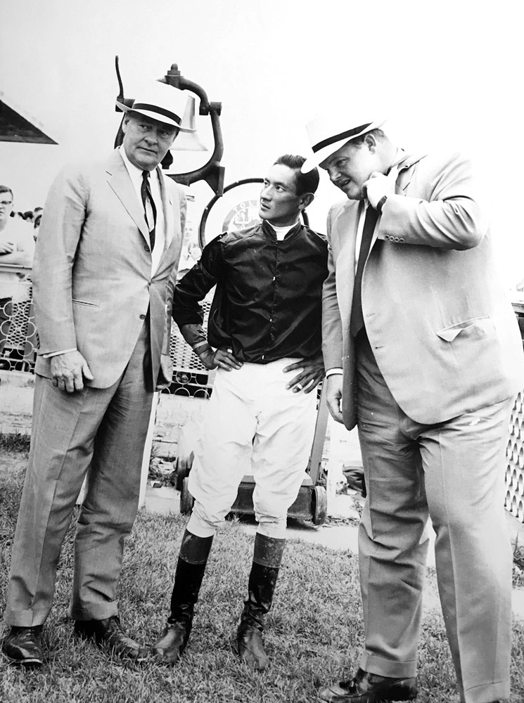 Ogden Phipps (left) with his son Ogden Mills "Dinny" Phipps and jockey Braulio Baeza in 1960 (Keeneland Library Thoroughbred Times Collection)
