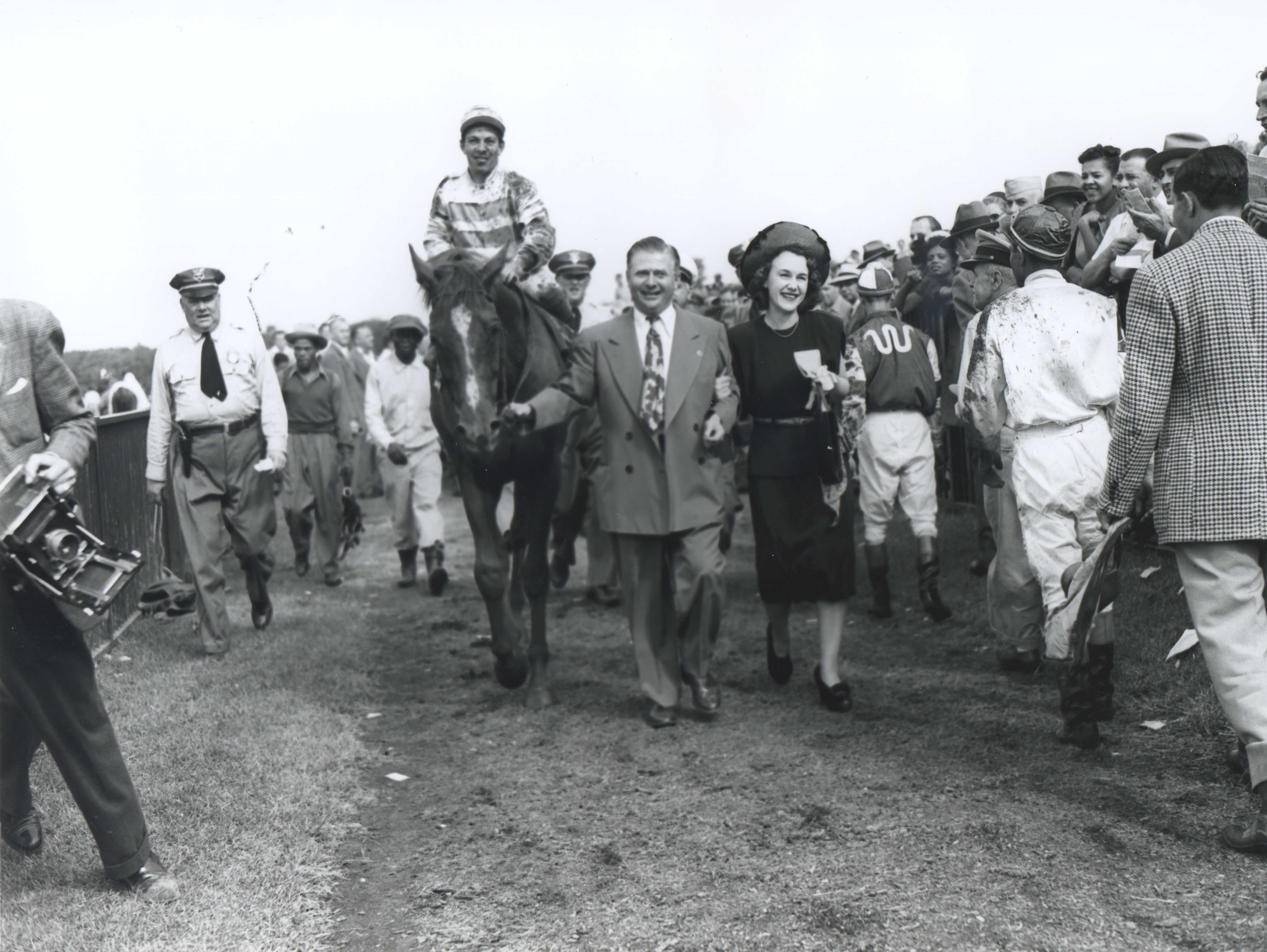 Hirsch and Ethel Jacobs lead in Stymie (Conn McCreary up) after winning the 1947 International Gold Cup at Empire City (Keeneland Library Morgan Collection/Museum Collection)