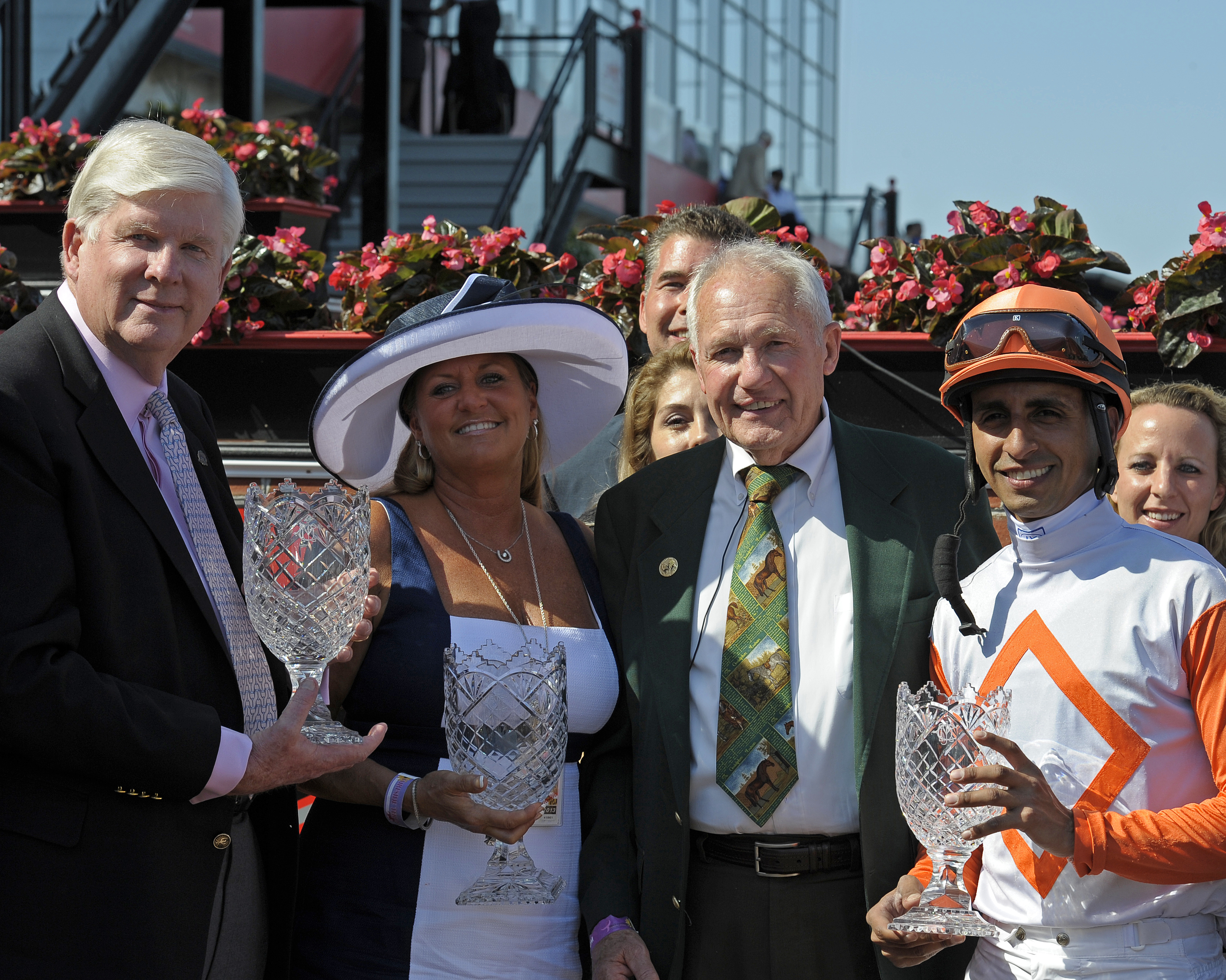 Trainer King Leatherbury (second right) at the trophy presentation for the 2013 Jim McKay Turf Sprint, won by Ben's Cat (Anne M. Eberhardt)
