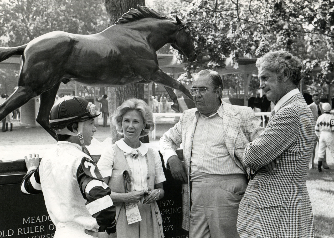 The connections of Triple Crown winner Affirmed (Steve Cauthen, Patrice Jacobs Wolfson, Laz Barrera, and Lou Wolfson) in the Belmont Paddock (NYRA/Museum Collection)