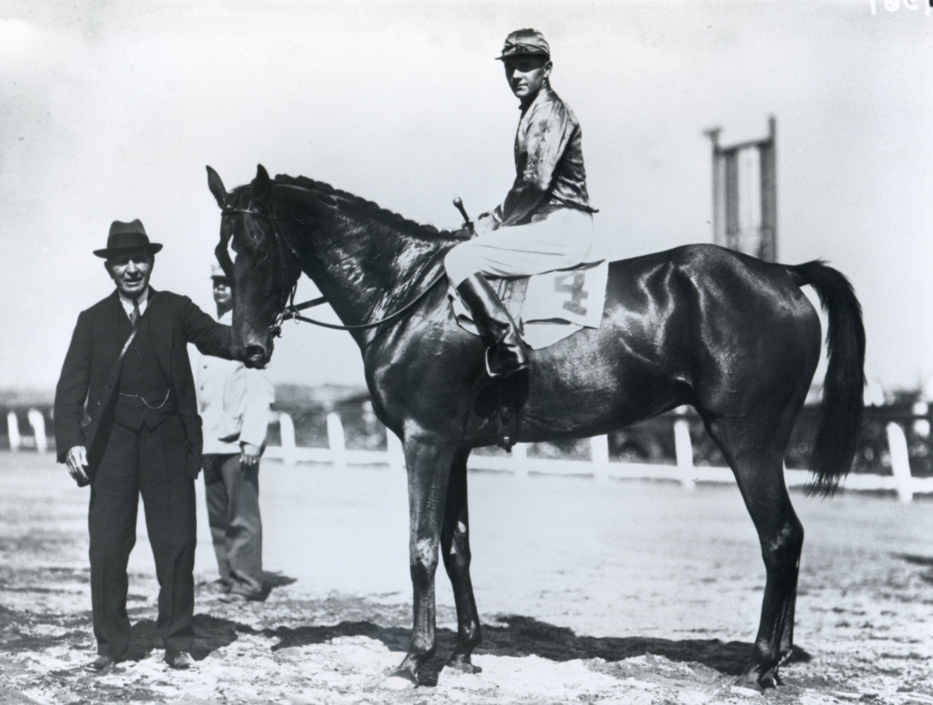 Trainer Thomas Hitchcock holding Actor (George Bostwick up) in the winner's circle for the 1930 Bushwick Steeplechase at Aqueduct (Keeneland Library Cook Collection/Museum Collection)