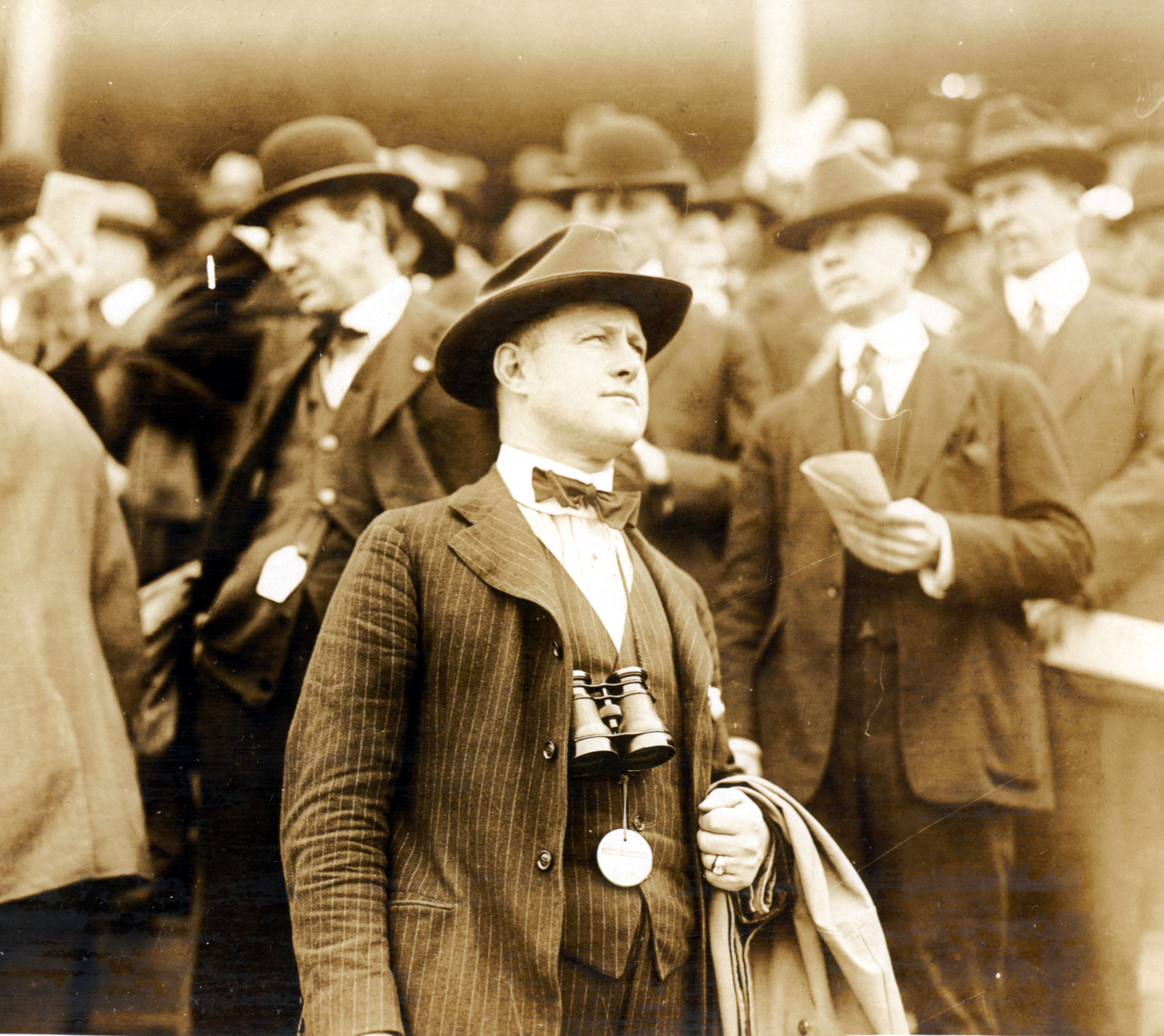 Ben Jones watching a race from the grandstand area of an unidentified track (Museum Collection)