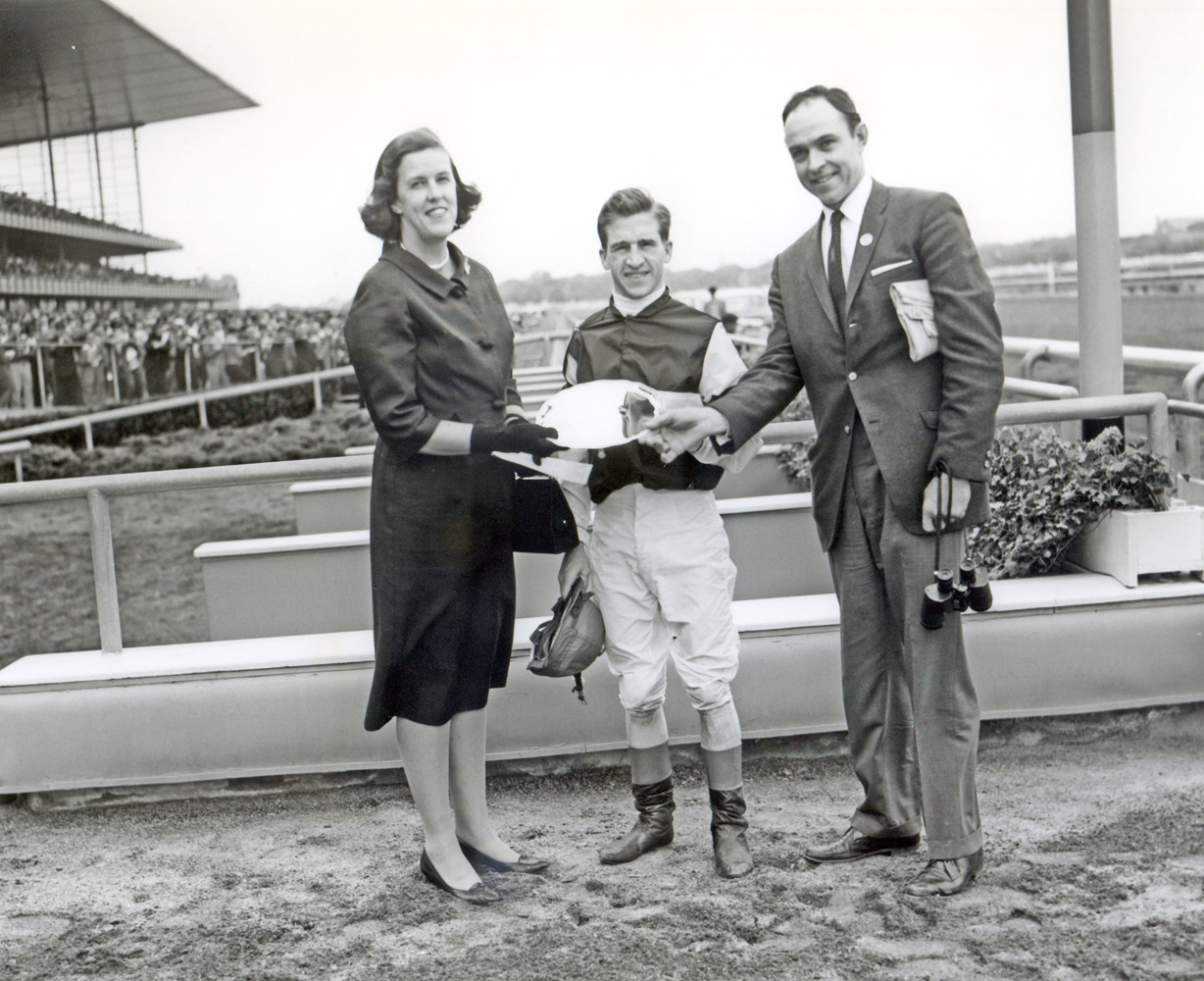 Jockey Bobby Ussery and trainer T. J. Kelly at the trophy presentation for the 1961 Juvenile at Aqueduct, won by Sunrise County (Keeneland Library Morgan Collection/Museum Collection)