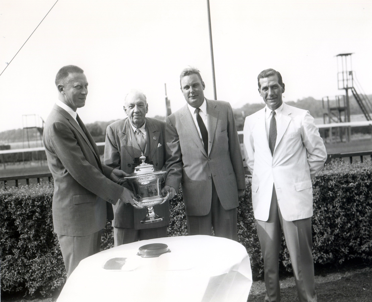 Trophy presentation for the winning connections of the 1957 Suburban Handicap at Belmont Park, won by Traffic Judge and trained by James Maloney (Keeneland Library Morgan Collection/Museum Collection)