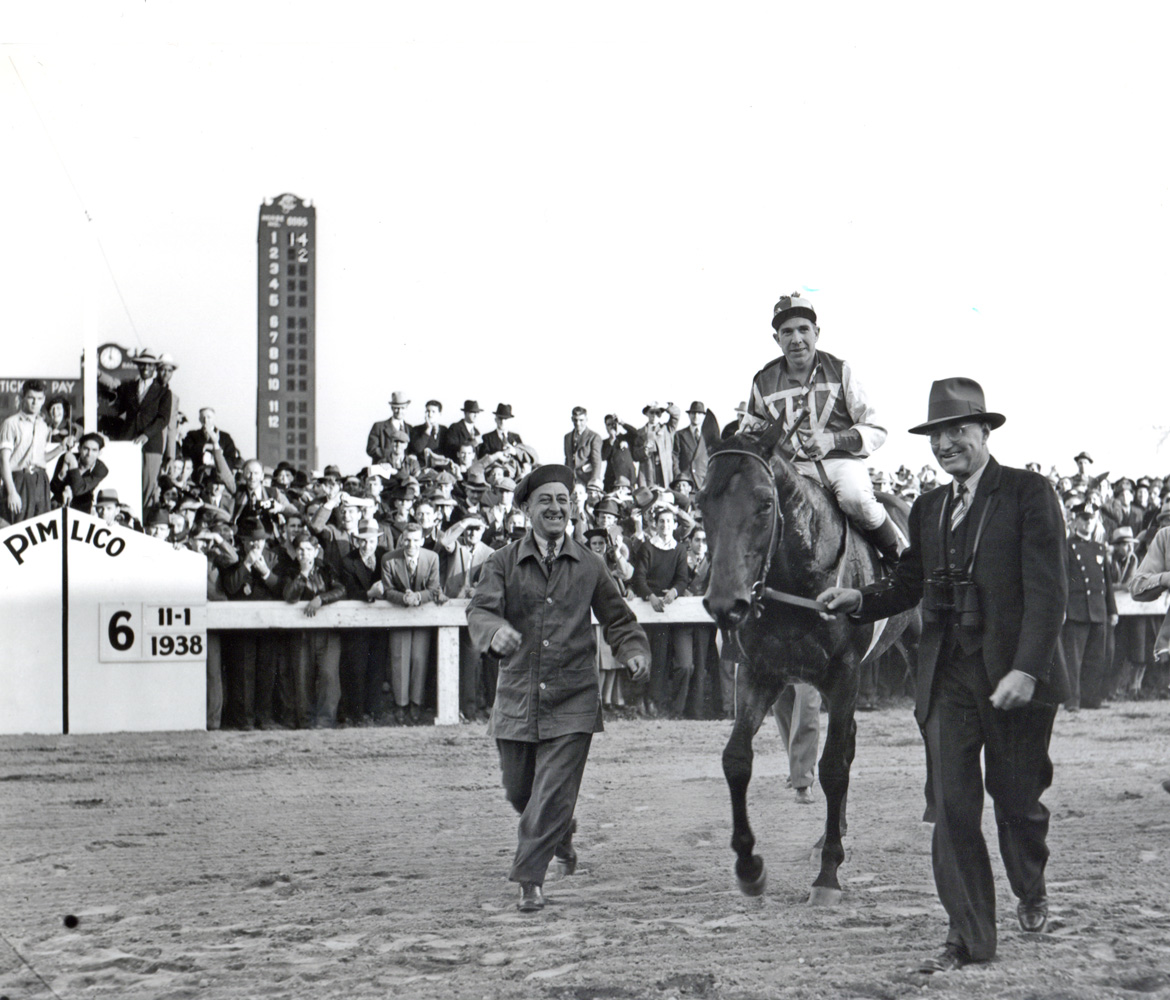 Tom Smith leads in Seabiscuit and George Woolf after they defeated Triple Crown winner War Admiral in the 1938 Pimlico Special match race (Keeneland Library Morgan Collection/Museum Collection)