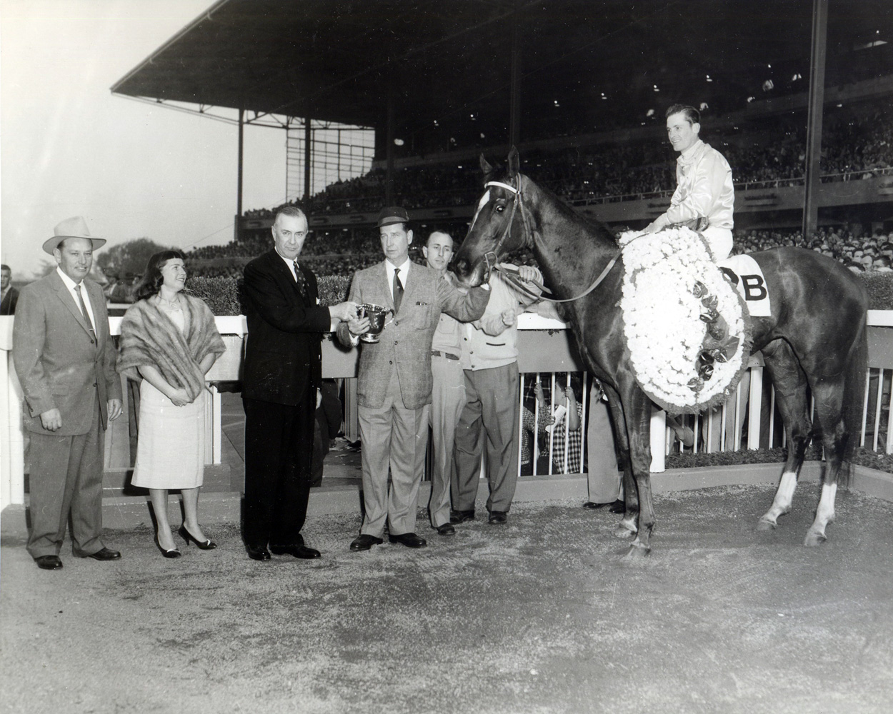 Trainer Robert Wheeler (far left) and owner C. V. Whitney join Silver Spoon (R. York up) in the winner's circle for the 1959 Santa Anita Derby (Museum Collection)