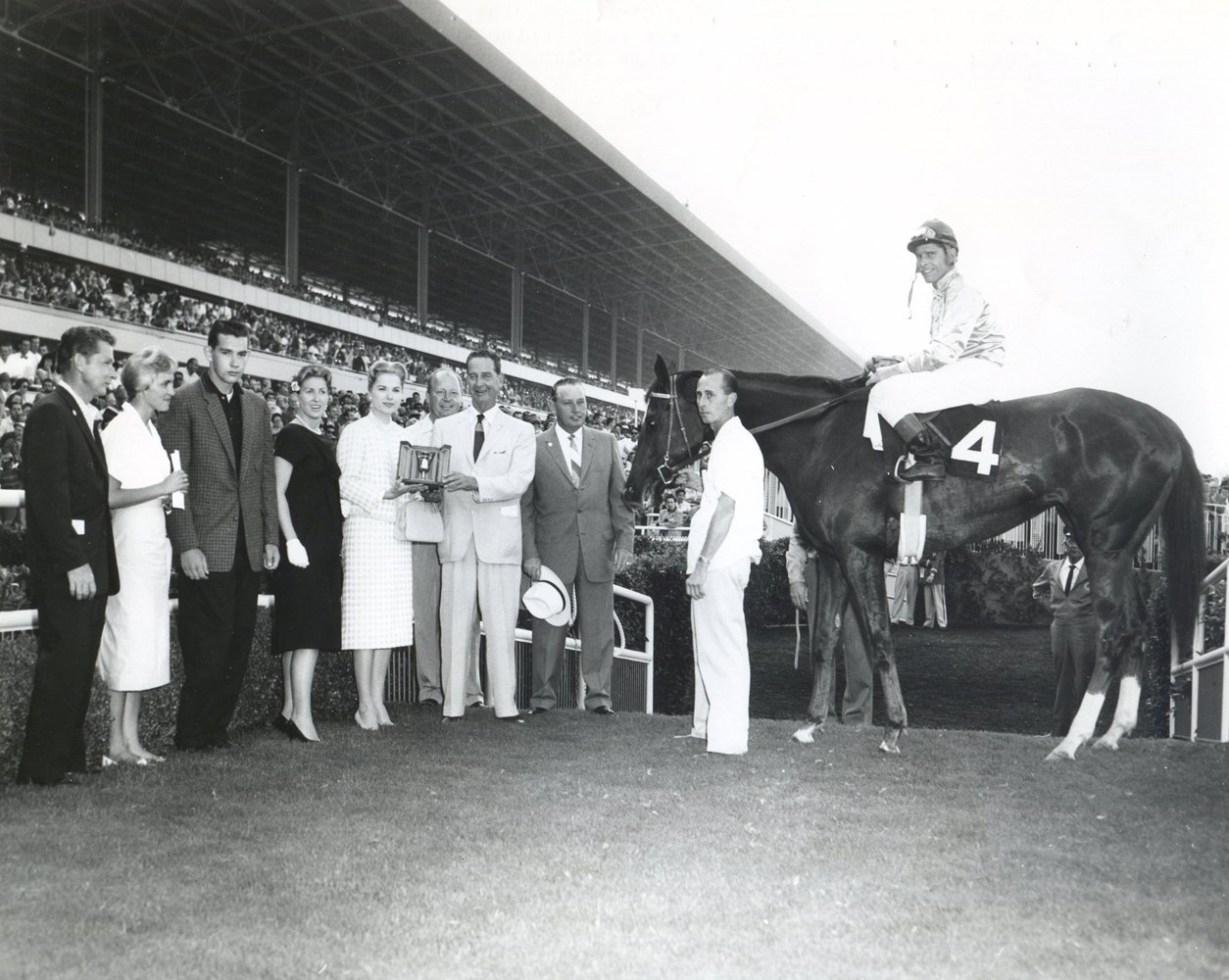 The winning connections of Silver Spoon in the winner's circle for the 1959 Cinema Handicap (Museum Collection)